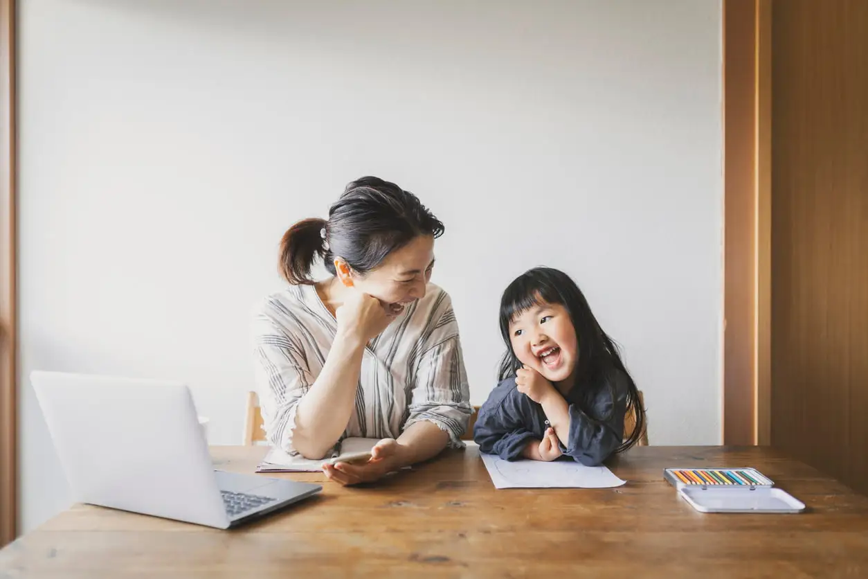 mother and daughter laughing