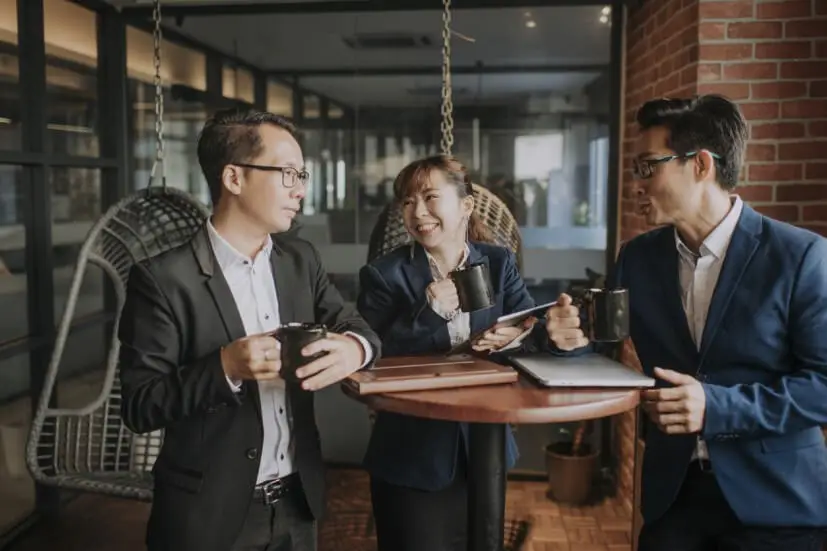 people chatting at a small table