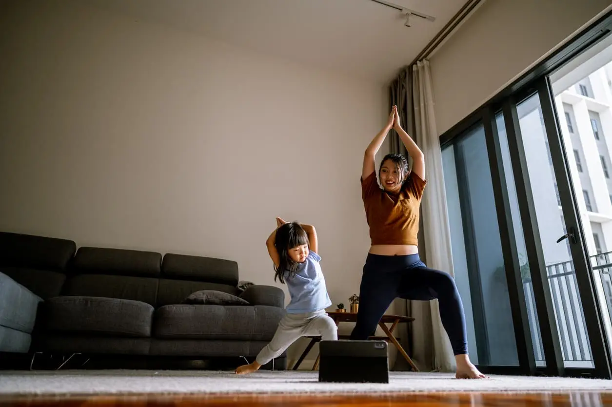 mother and daughter exercising together