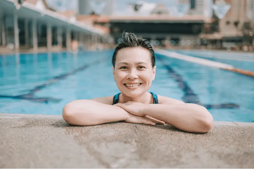 lady in a swimming pool smiling