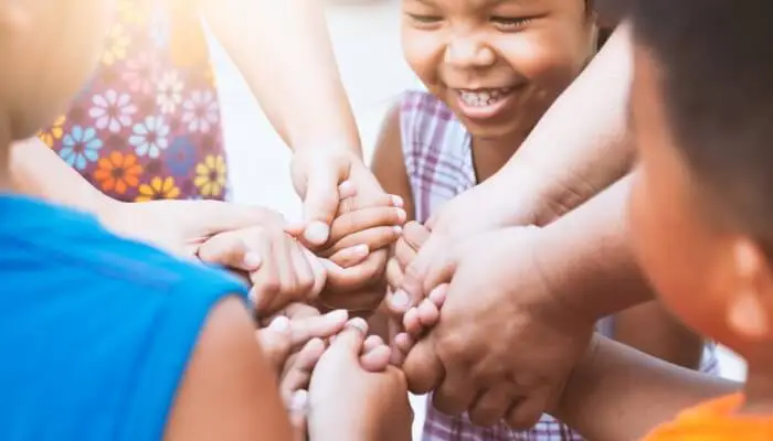 mother smiling and holding daughter