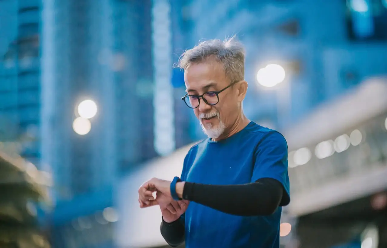elderly checking fitness watch