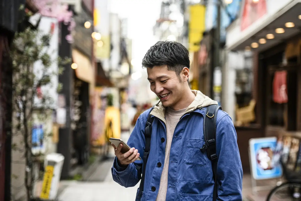 man-looking-at-phone-travel