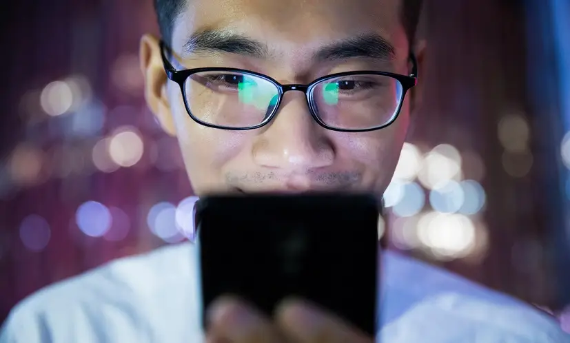 man looking at phone