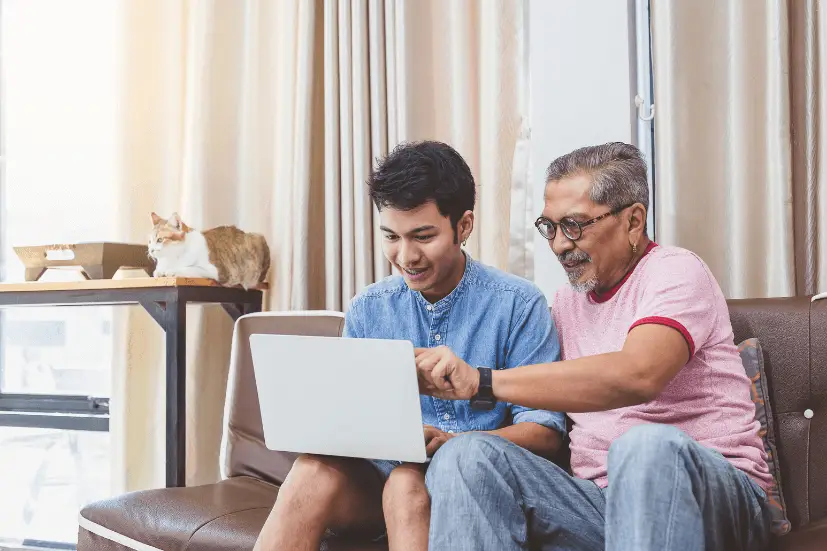 Man and father looking at laptop for retirement planning​