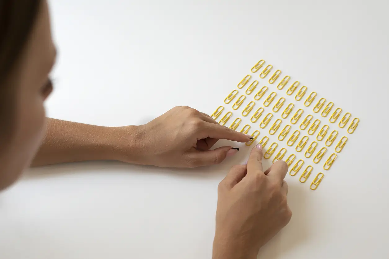 woman sorting out paper clips ocd