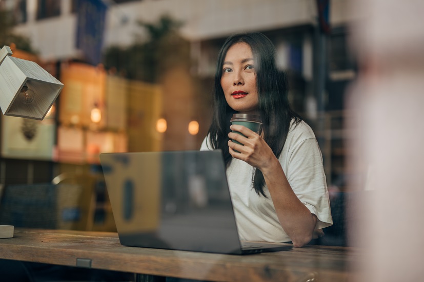 woman looking out a window