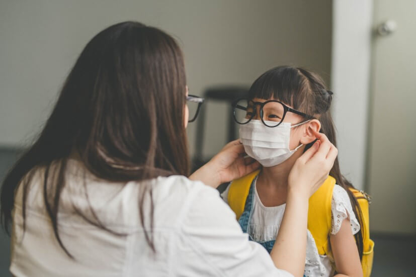 small girl with mask