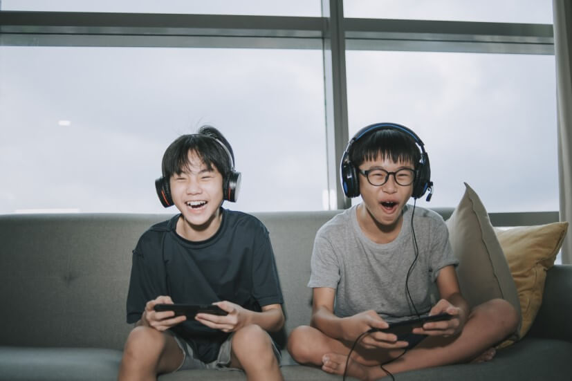 Teenage boys playing games