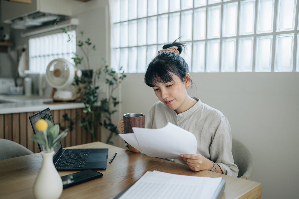 woman looking at papers