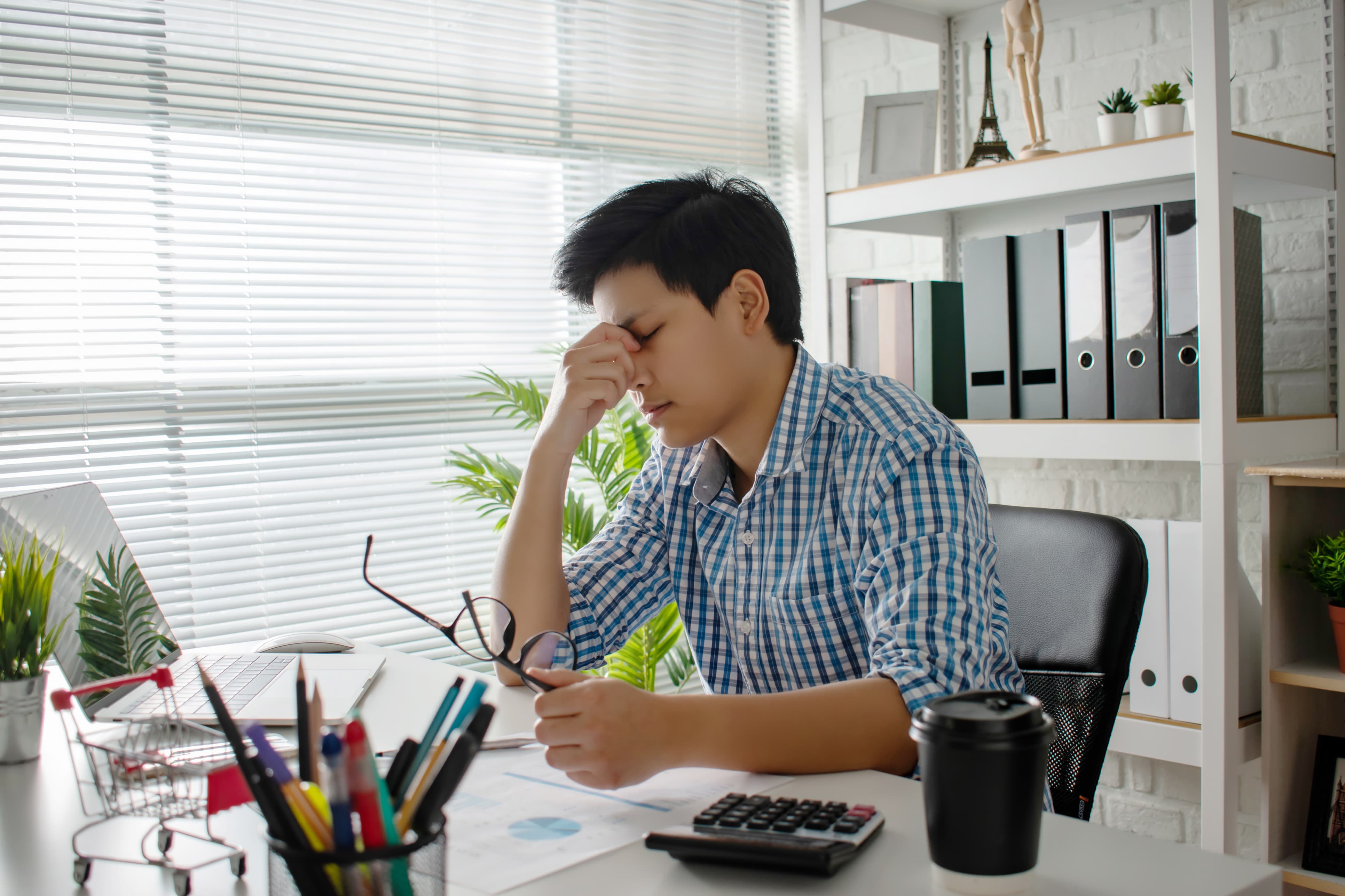 Stressed Man Rubbing Nose Bridge