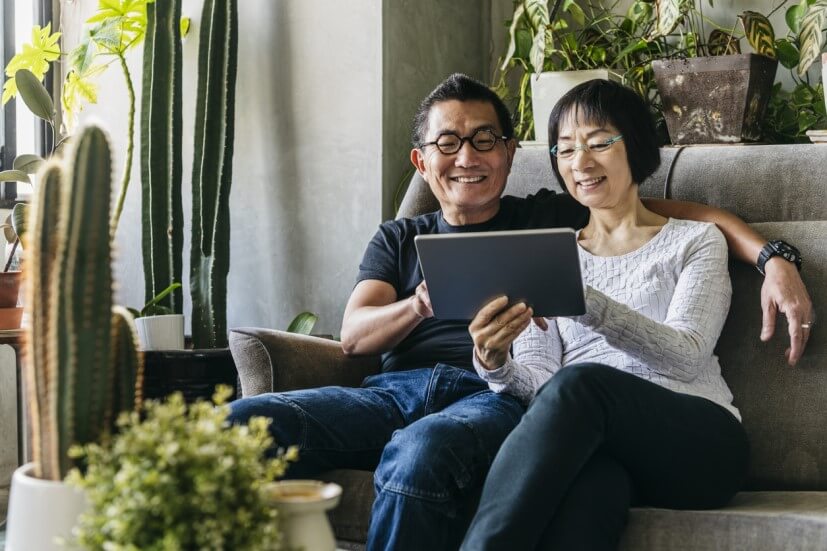 Couple looking thru retirement plans