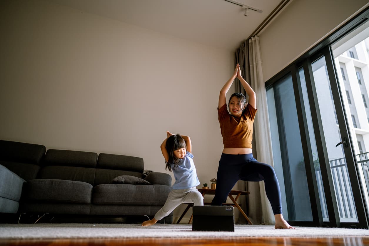 mother and daughter exercising together