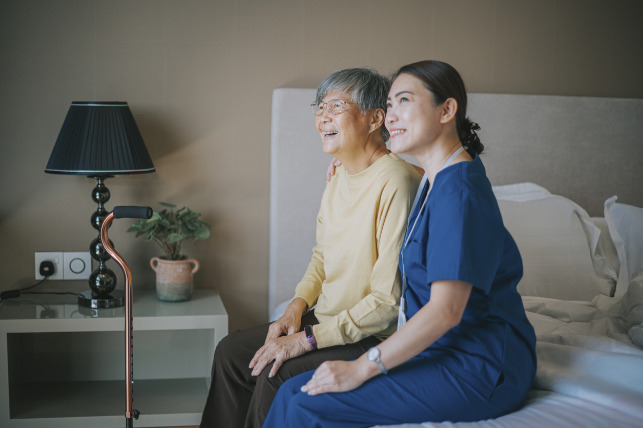 elderly woman with caregiver